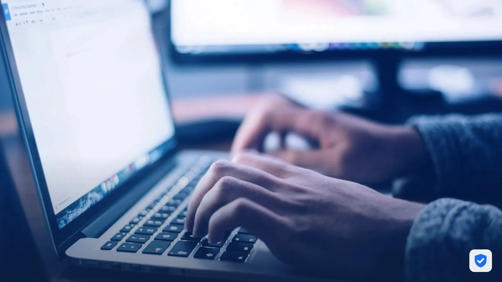 Member of our security team working on a laptop to clean a hacked website